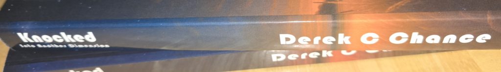 Knocked - Into Another Dimension - Paperback spine
